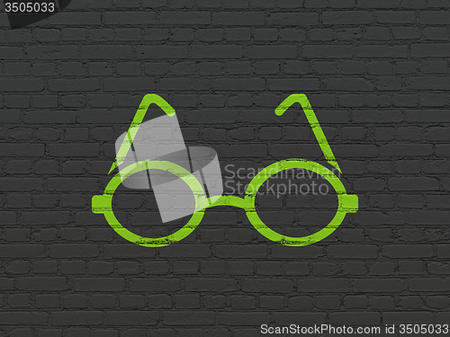 Image of Studying concept: Glasses on wall background