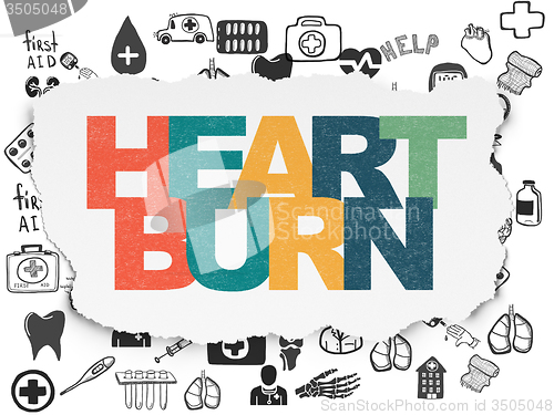 Image of Health concept: Heartburn on Torn Paper background