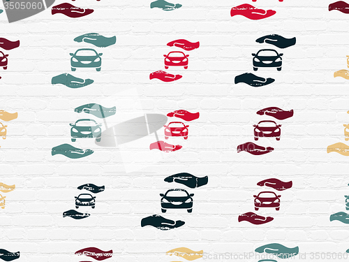 Image of Insurance concept: Car And Palm icons on wall background