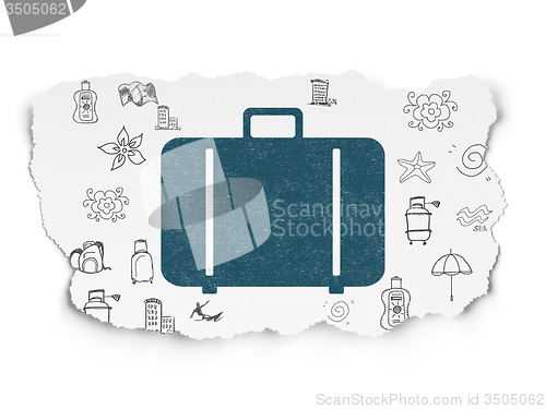 Image of Travel concept: Bag on Torn Paper background