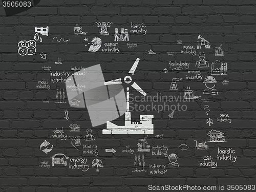 Image of Industry concept: Windmill on wall background