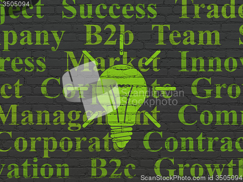Image of Finance concept: Light Bulb on wall background