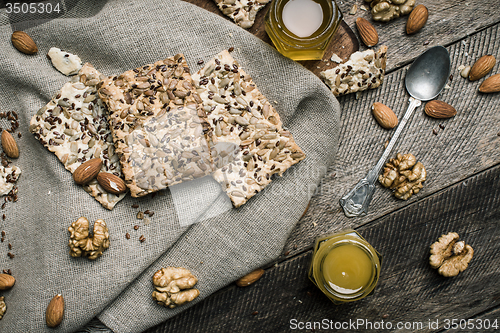 Image of dietic Cookies with seeds nuts honey on wood