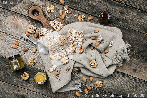 Image of Cookies honey  nuts on wooden table