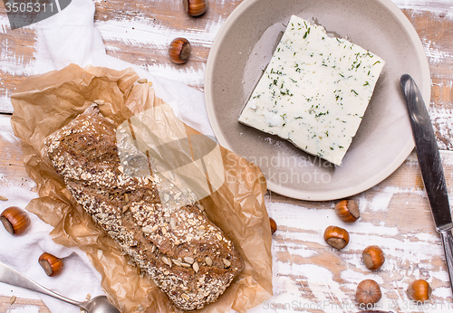 Image of Bread with seeds and cheese for breakfast on table