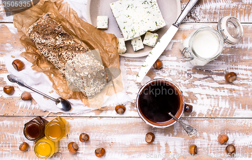 Image of Morning tea Bread with seeds and cheese on wooden table