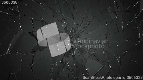 Image of Pieces of splitted or cracked glass on black