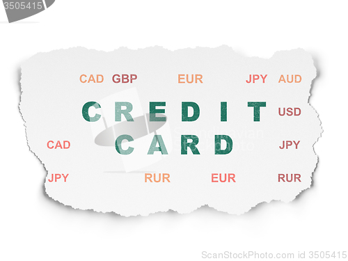 Image of Currency concept: Credit Card on Torn Paper background