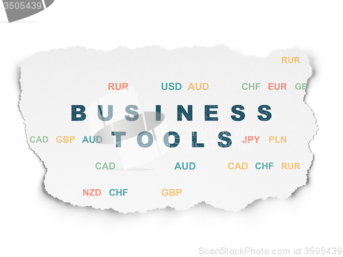 Image of Finance concept: Business Tools on Torn Paper background