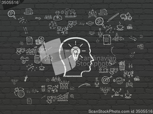 Image of Business concept: Head With Lightbulb on wall background