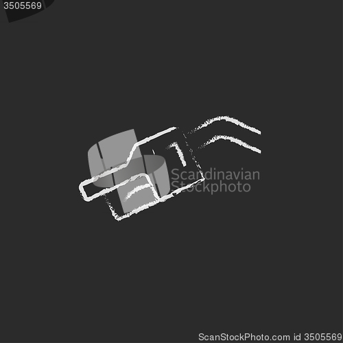 Image of Gasoline pump nozzle icon drawn in chalk.