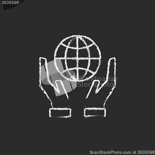 Image of Two hands holding globe icon drawn in chalk.