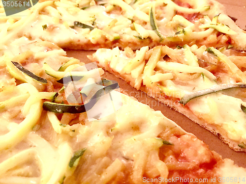 Image of Slice of pizza with potatoes and zucchini