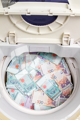 Image of Malaysia Currency in washing machine