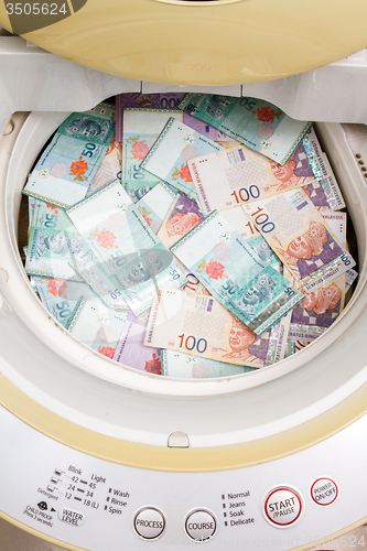 Image of Malaysia Currency in washing machine