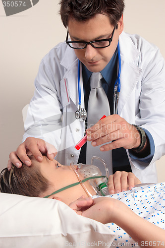 Image of Doctor checking patient eyes