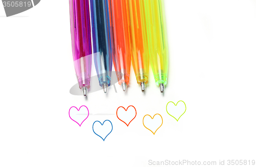 Image of Bright colorful pens and abstract hearts