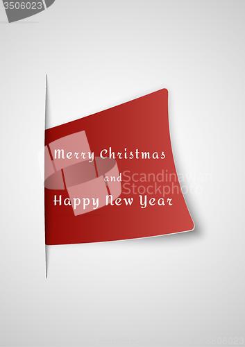 Image of merry christmas card inserted into paper