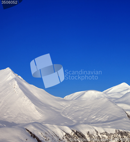 Image of Snowy mountains and blue clear sky at nice morning