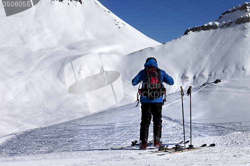 Image of Skier on ski slope at sun day