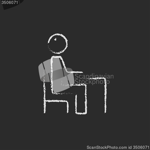 Image of Student sitting on a chair in front of the desk icon drawn chalk.