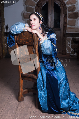 Image of Attractive woman in blue baroque dress