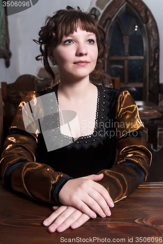 Image of Attractive woman in red dress in retro baroque style