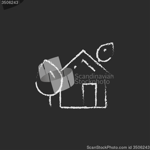Image of Eco-friendly house icon drawn in chalk.
