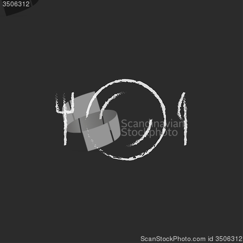 Image of Plate with cutlery icon drawn in chalk.