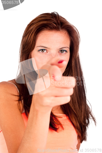 Image of Young elegant woman pointing with freckles