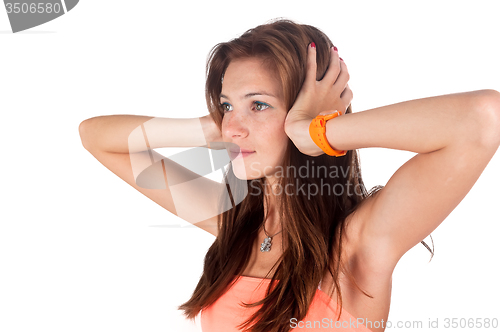 Image of Hear no evil. Young pretty woman covering her ears