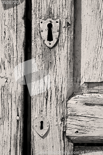 Image of door    in italy old ancian wood and traditional  texture nail