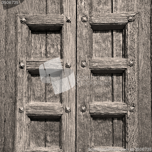 Image of door    in italy old ancian wood and traditional  texture nail