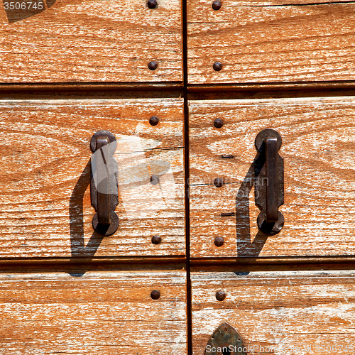 Image of door    in italy old ancian wood and traditional  texture nail