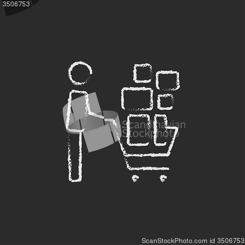 Image of Man pushing shopping cart icon drawn in chalk.