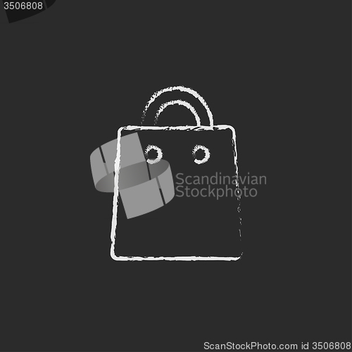Image of Shopping bag icon drawn in chalk.