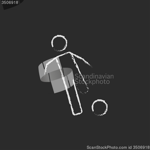 Image of Soccer player with ball icon drawn in chalk.