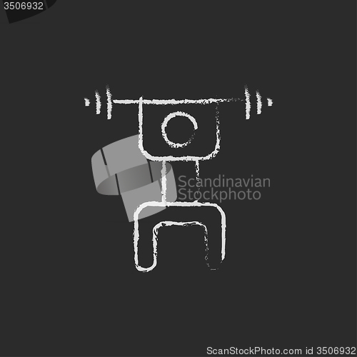 Image of Man with barbell icon drawn in chalk.