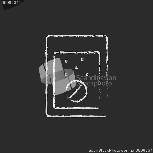 Image of Tablet into a glass of water icon drawn in chalk.