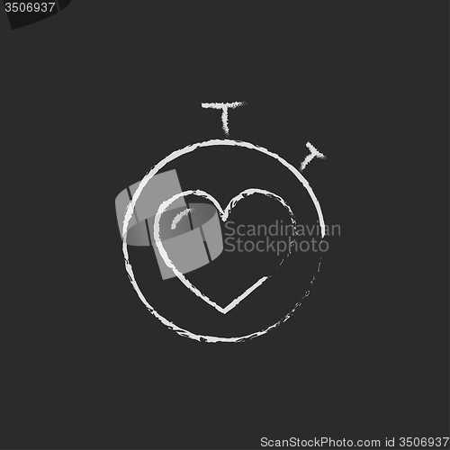 Image of Stopwatch with heart icon drawn in chalk.