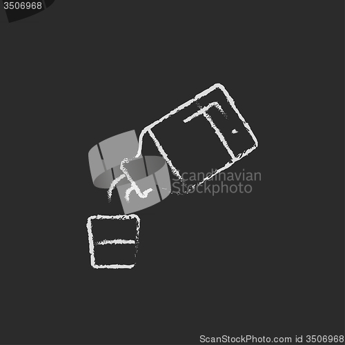 Image of Medicine and measuring cup icon drawn in chalk.