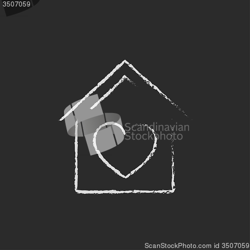 Image of House with heart symbol icon drawn in chalk.