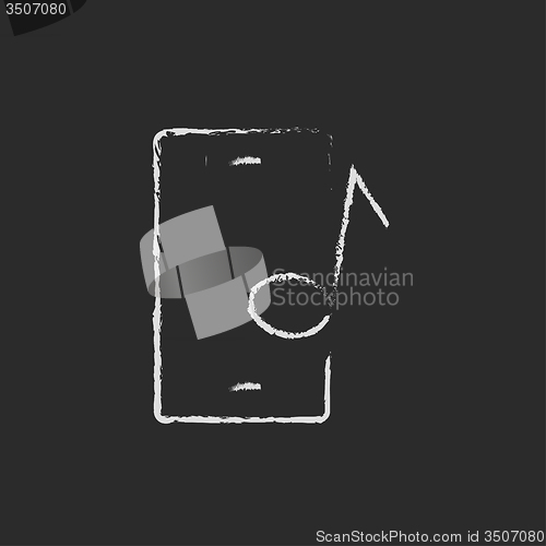 Image of Smartphone with music note icon drawn in chalk.