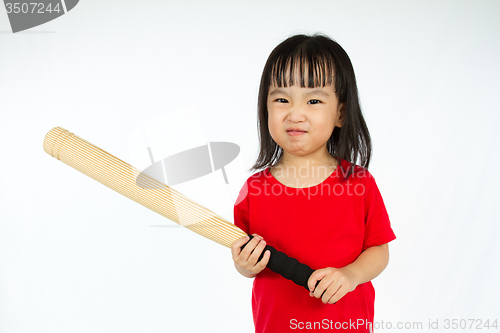 Image of Chinese little girl holding baseball bat with angry expression