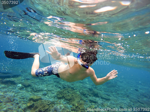 Image of Underwater shoot of a young boy snorkeling