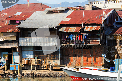 Image of Straw poor houses by the river