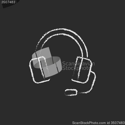 Image of Headphone with microphone icon drawn in chalk.