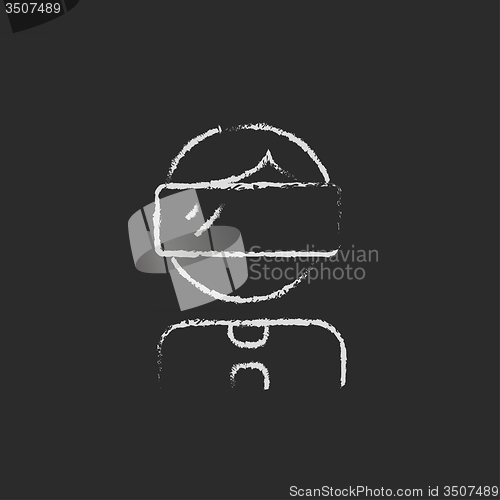 Image of Man wearing virtual reality headset icon drawn in chalk.