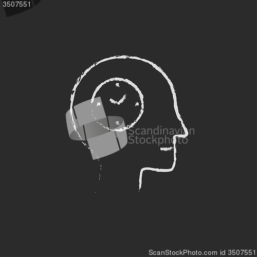 Image of Clock in the human head icon drawn chalk