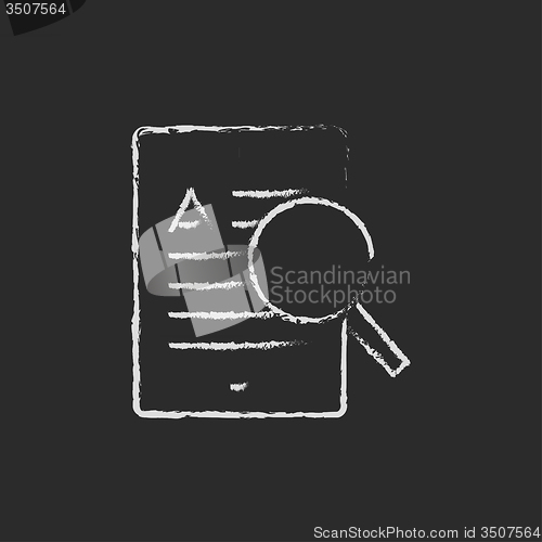 Image of Tablet and magnifying glass icon drawn in chalk.